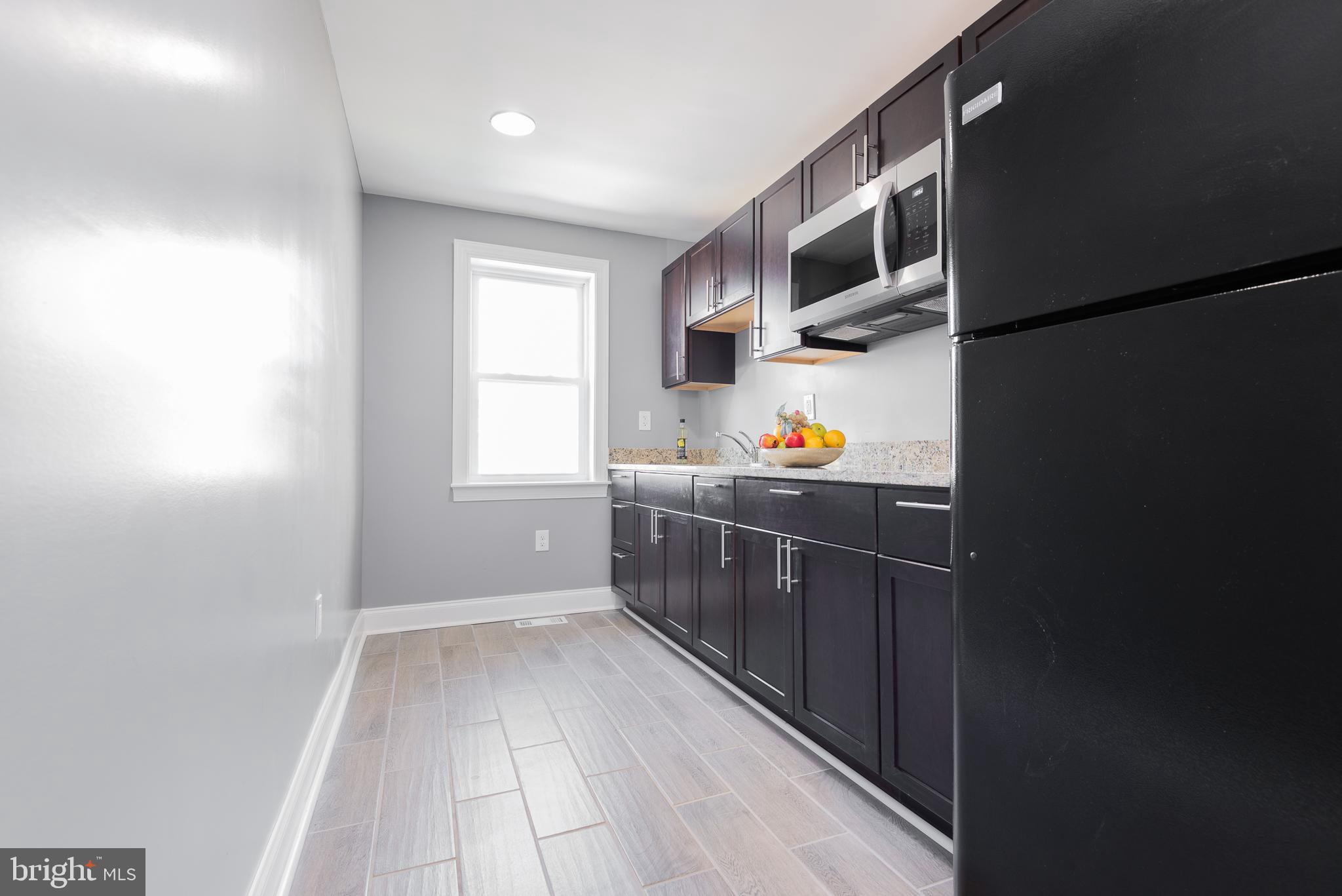 4924 Brookwood Road Baltimore, MD 21225 - Photo 13 of 24 Upper level Wet Bar