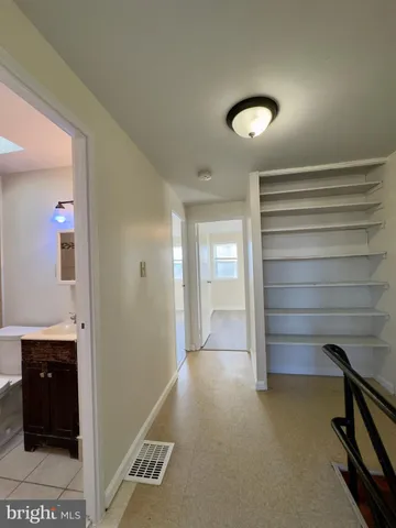 a view of a hallway with closet