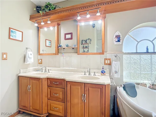 a view of a hallway with a window and wooden floor
