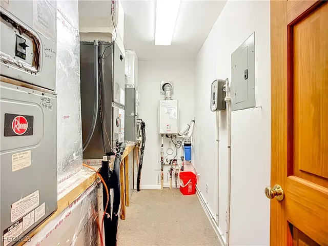 a view of a patio with table and chairs and floor to ceiling window with wooden floor