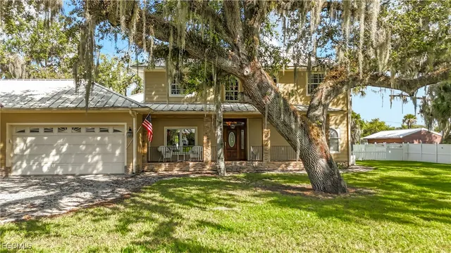 a front view of a building with a yard