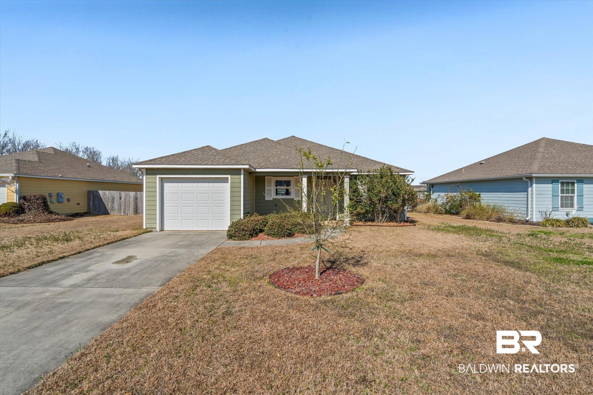 919 Sailor Circle Foley, AL 36535 - Photo 23 of 24 Ranch-style home featuring concrete driveway, a front yard, a shingled roof, and an attached garage