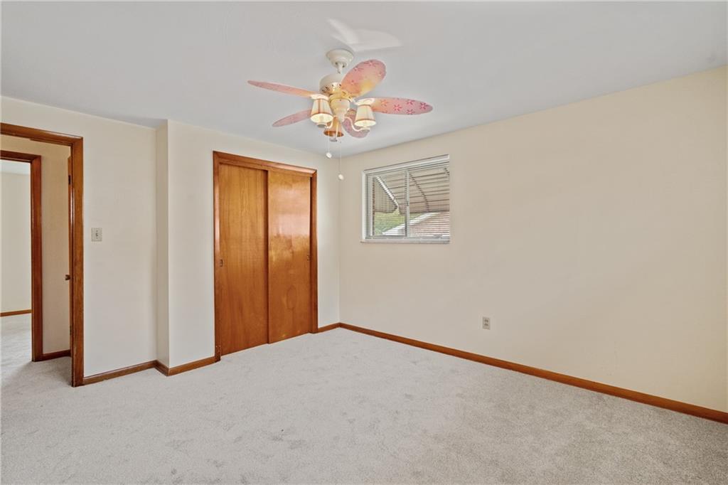 11490 McKee Road Irwin, PA 15642 - Photo 20 of 28 an empty room with windows and fan