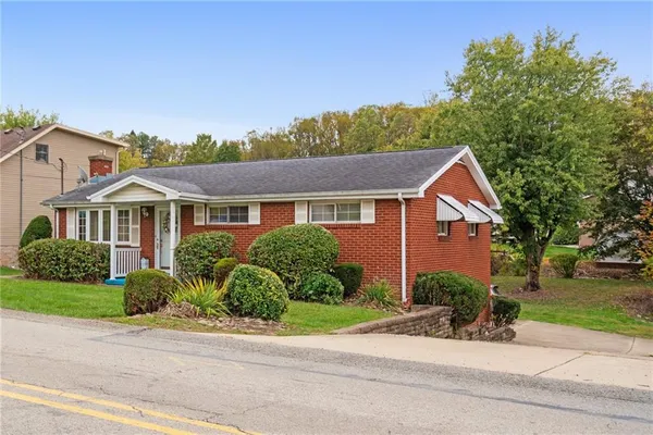 front view of a house with a yard