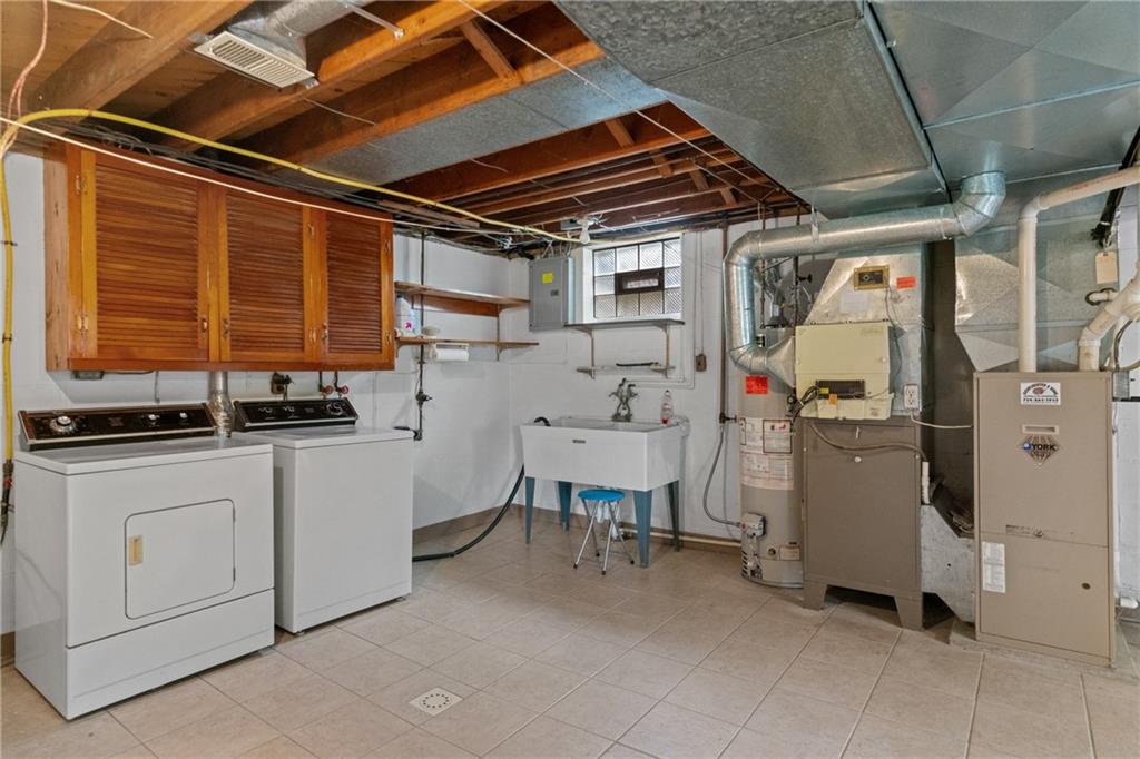 11490 McKee Road Irwin, PA 15642 - Photo 21 of 28 a utility room with dryer and washer