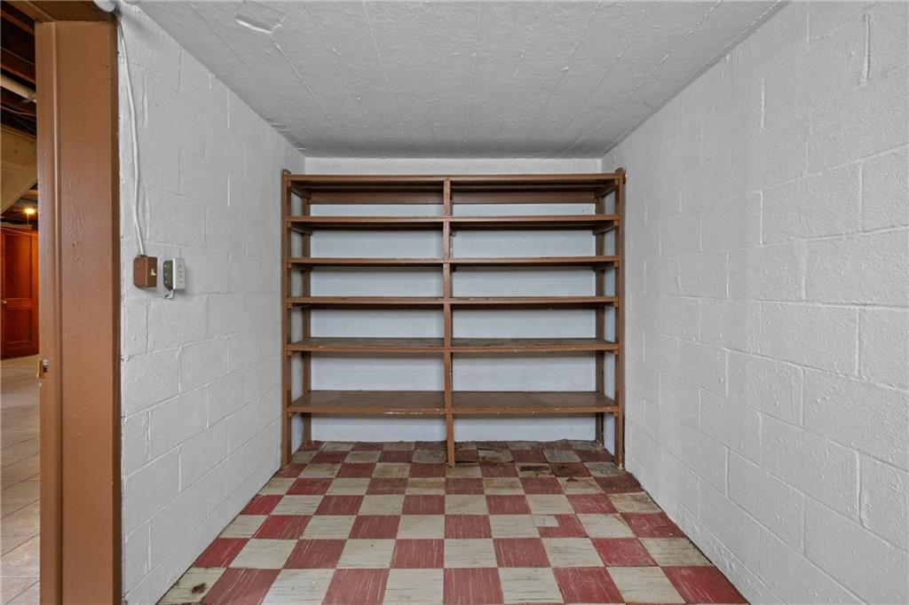 11490 McKee Road Irwin, PA 15642 - Photo 23 of 28 a room with a black white checkered floor