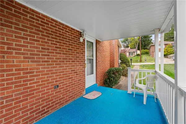 a view of an empty room with a porch