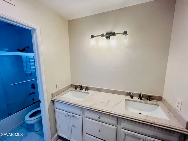 a bathroom with a sink and a toilet