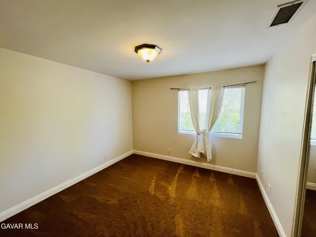 an empty room with large window