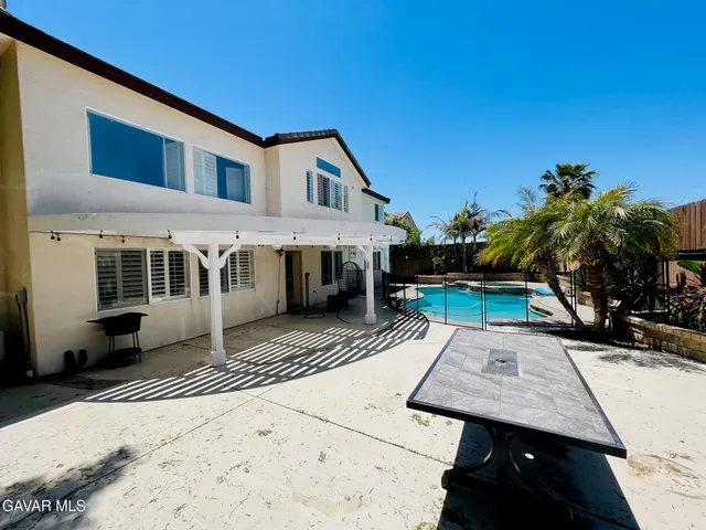 a view of a swimming pool with a lounge chairs