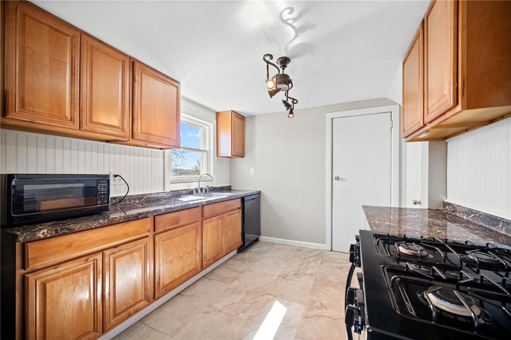 4030 Lebanon Church Road West Mifflin, PA 15122 - Photo 14 of 45 a kitchen with stainless steel appliances granite countertop a stove and a sink