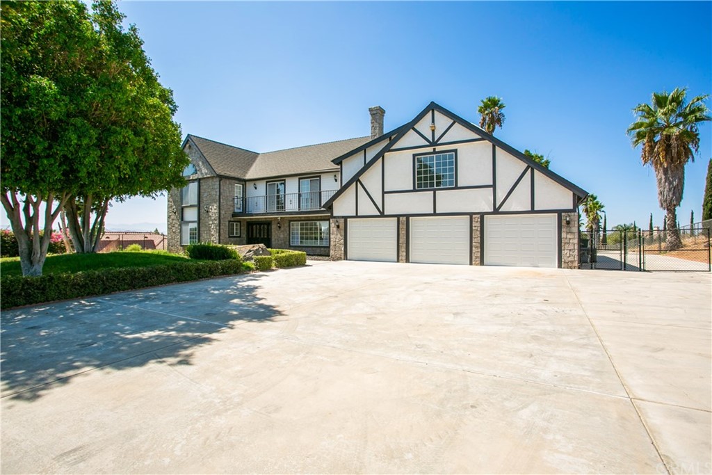 14185 Bush Avenue Riverside, CA 92508 - Photo 1 of 1 a view of house with a yard and potted plants