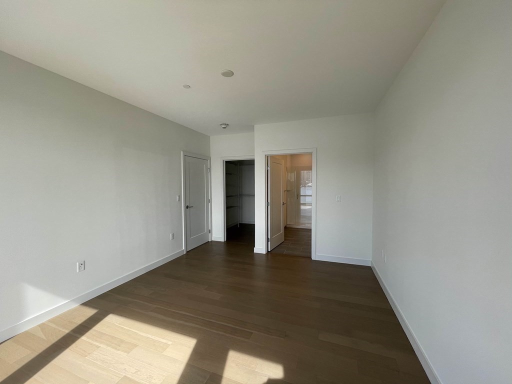 45 Lewis Street, Unit 310 Boston, MA 02128 - Photo 5 of 11 a view of an empty room and window