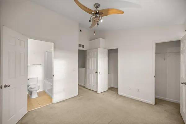 a bathroom with a toilet and a bathtub