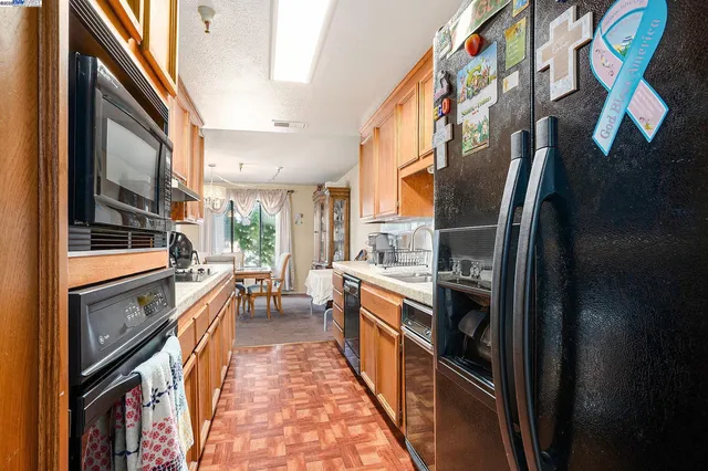 a bedroom with bed and a large mirror