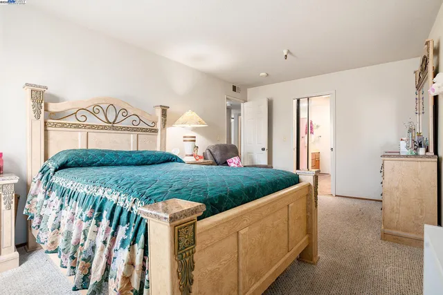 a bedroom with furniture and a window