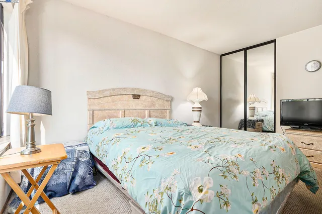 a bathroom with a sink vanity mirror and shower