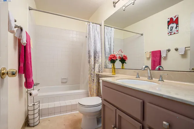 a view of a livingroom with furniture and a kitchen