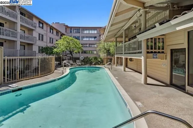 a front view of a building and car parked