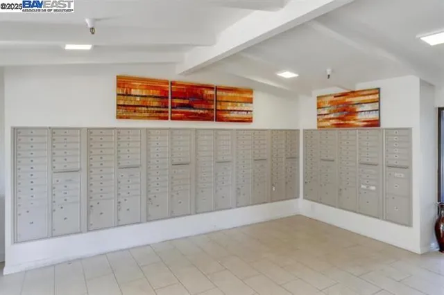 a living room with furniture a fireplace and a chandelier