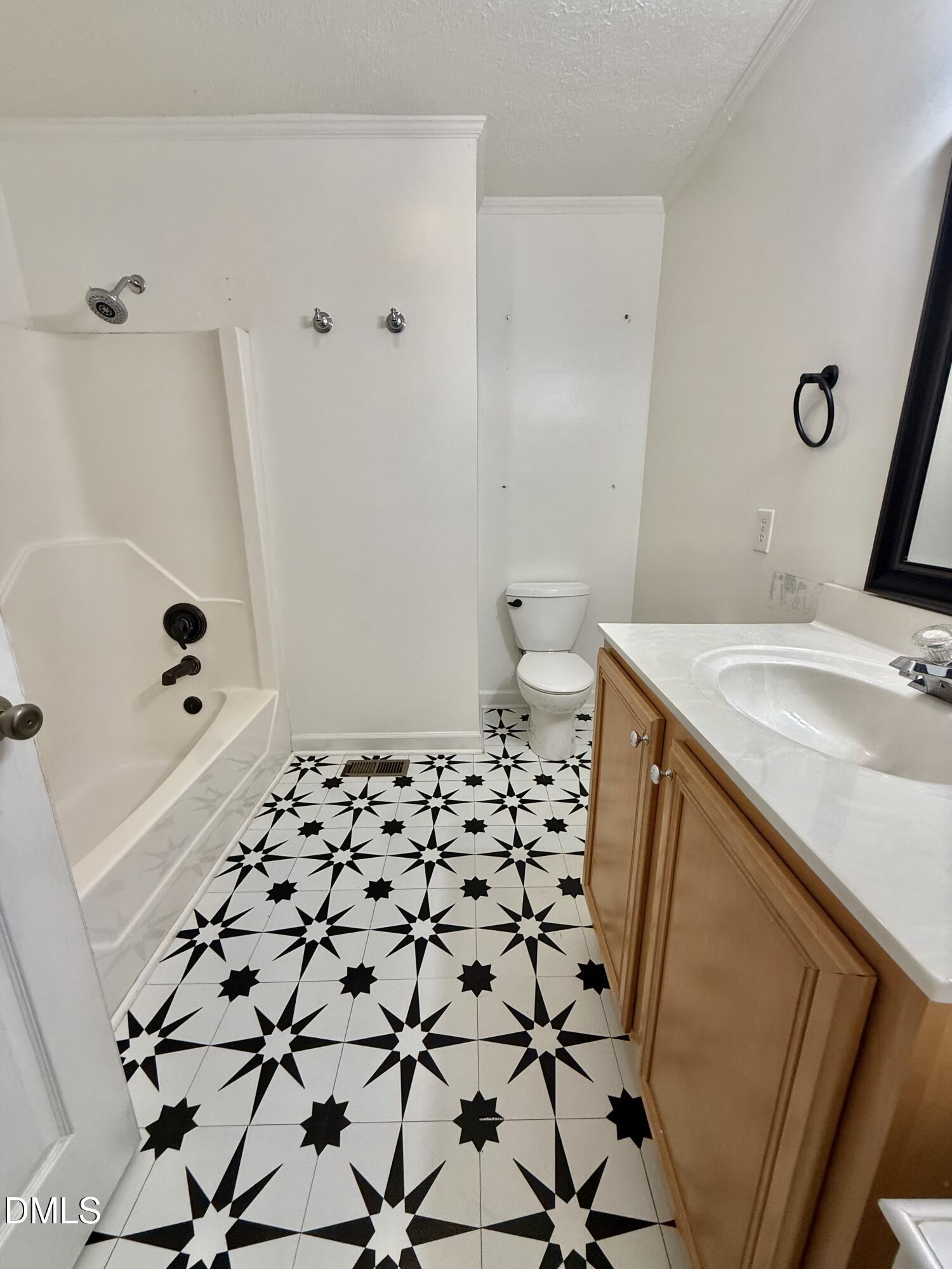 2320 Poindexter Road Hurdle Mills, NC 27541 - Photo 17 of 57 a bathroom with a sink and a mirror