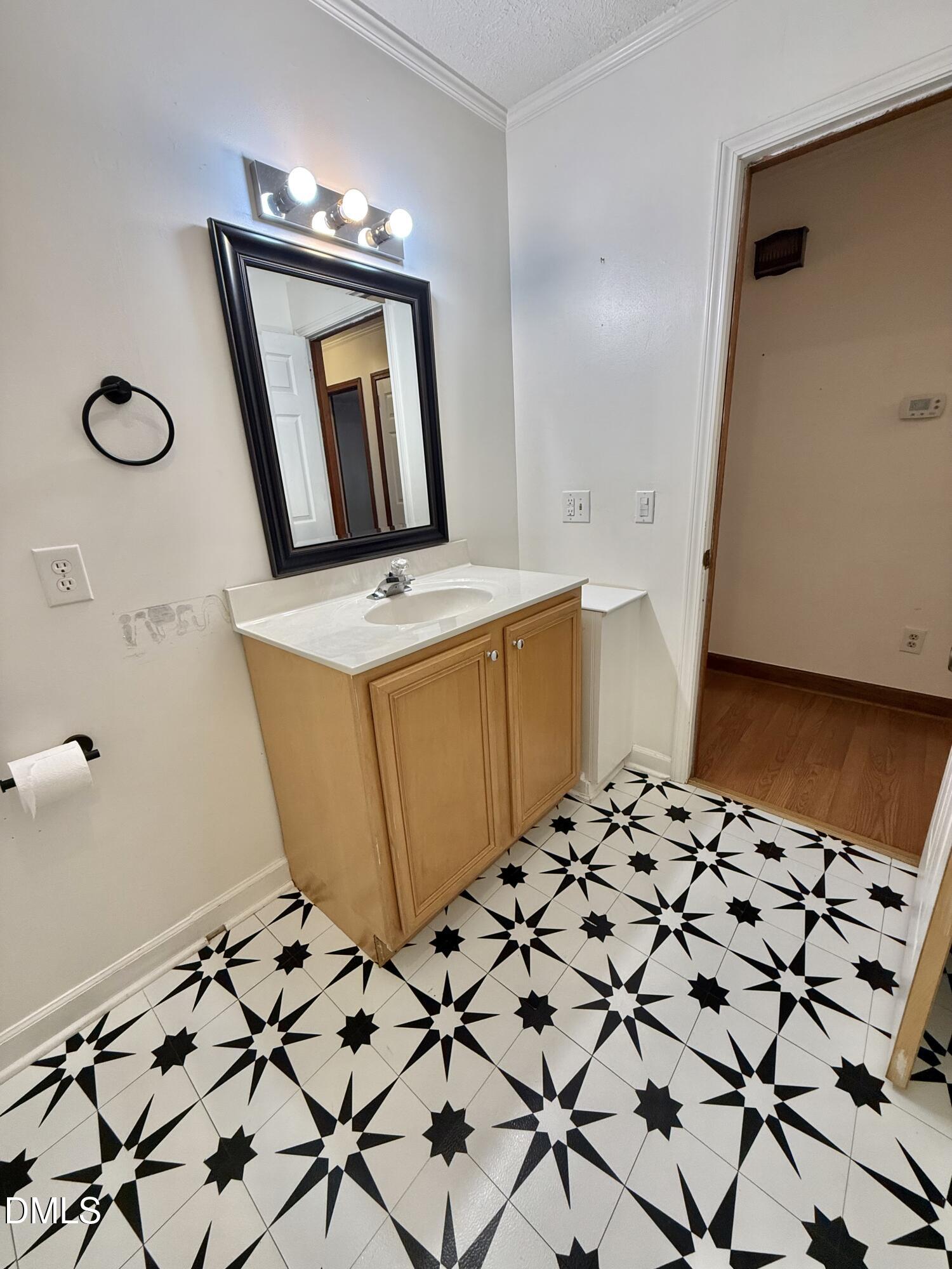 2320 Poindexter Road Hurdle Mills, NC 27541 - Photo 18 of 57 a bathroom with a sink toilet and mirror