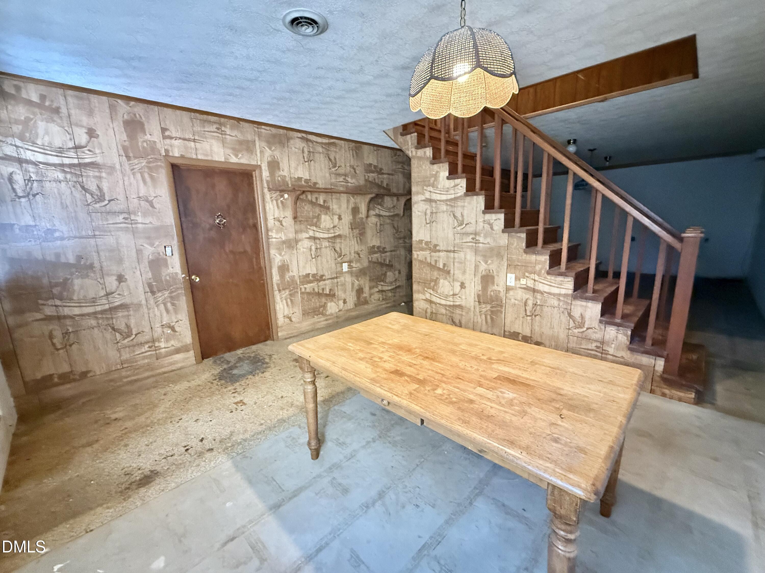 2320 Poindexter Road Hurdle Mills, NC 27541 - Photo 28 of 57 a view of a livingroom with wooden floor and stairs
