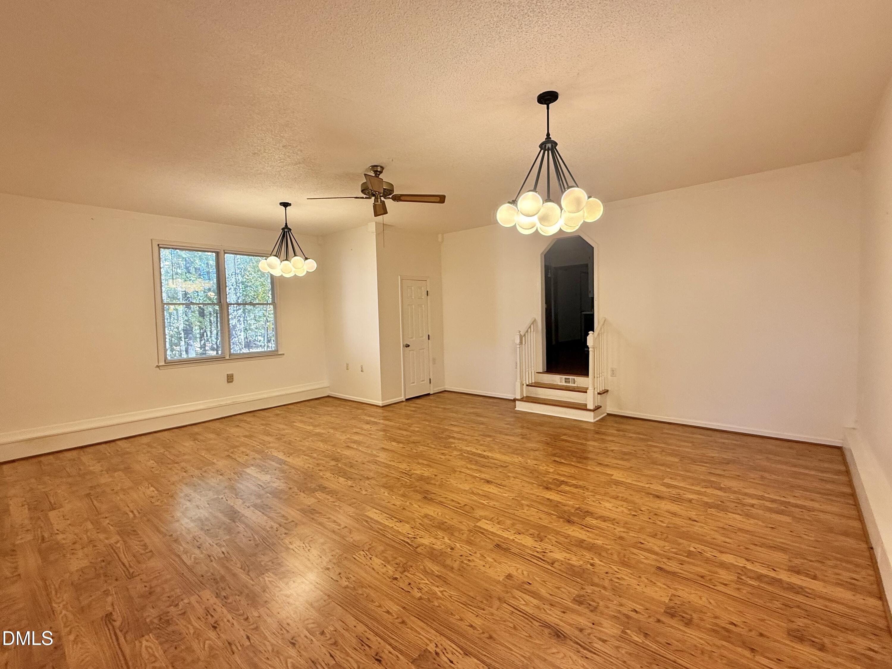 2320 Poindexter Road Hurdle Mills, NC 27541 - Photo 4 of 57 a view of a room with window and wooden floor