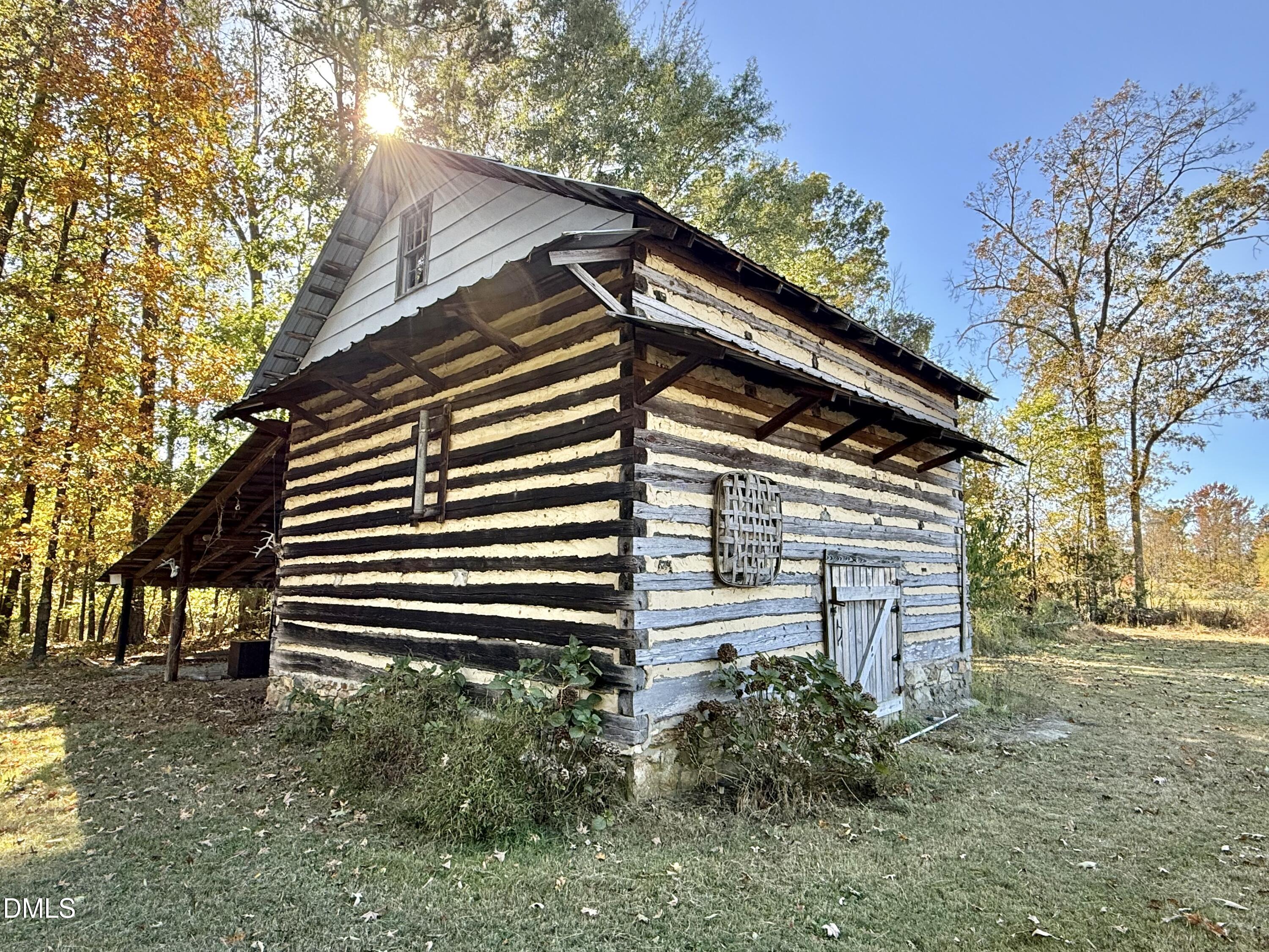 2320 Poindexter Road Hurdle Mills, NC 27541 - Photo 41 of 57 a front view of house with a garden