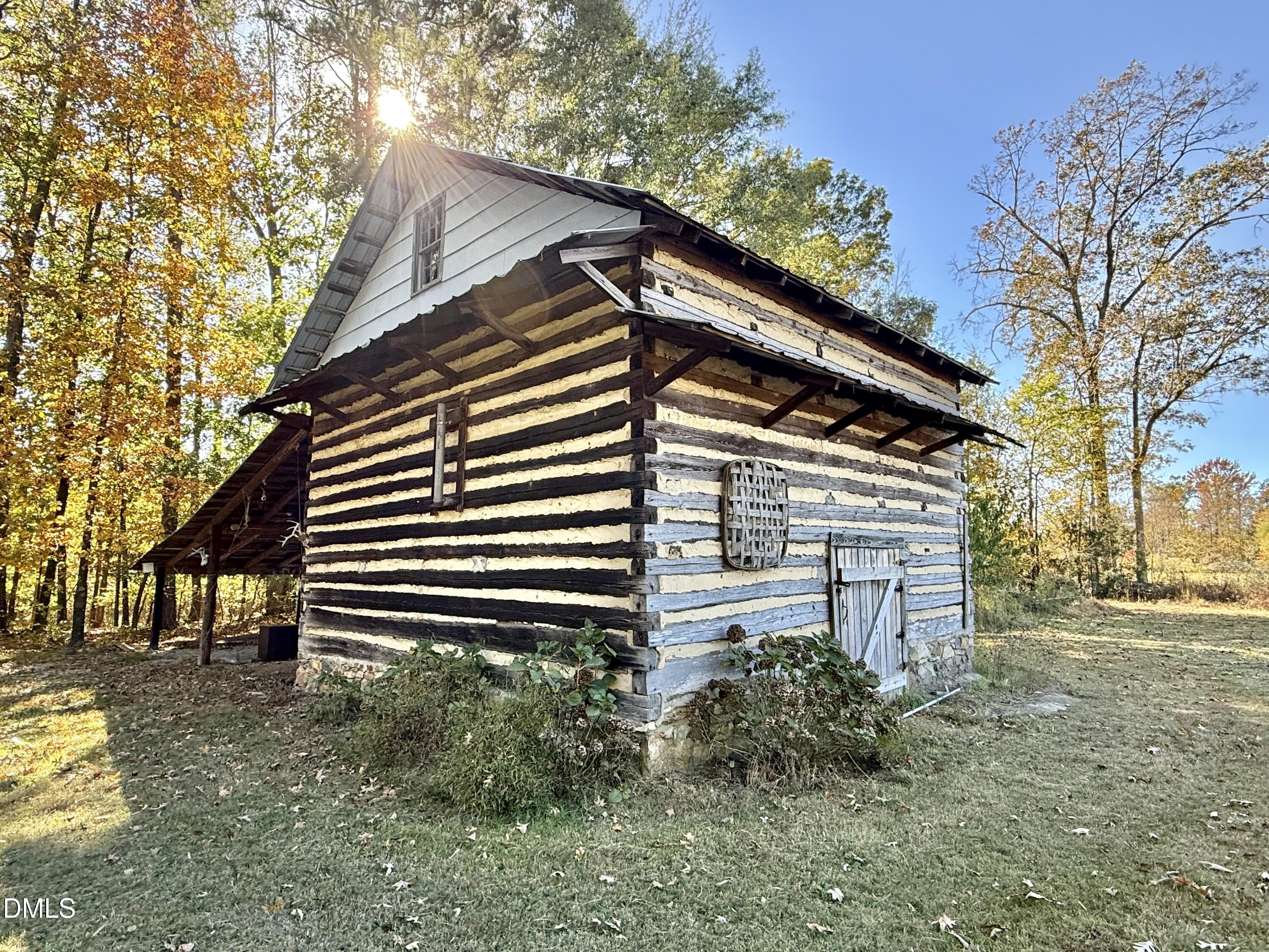 2320 Poindexter Road Hurdle Mills, NC 27541 - Photo 42 of 57 a backyard of a house with lots of green space
