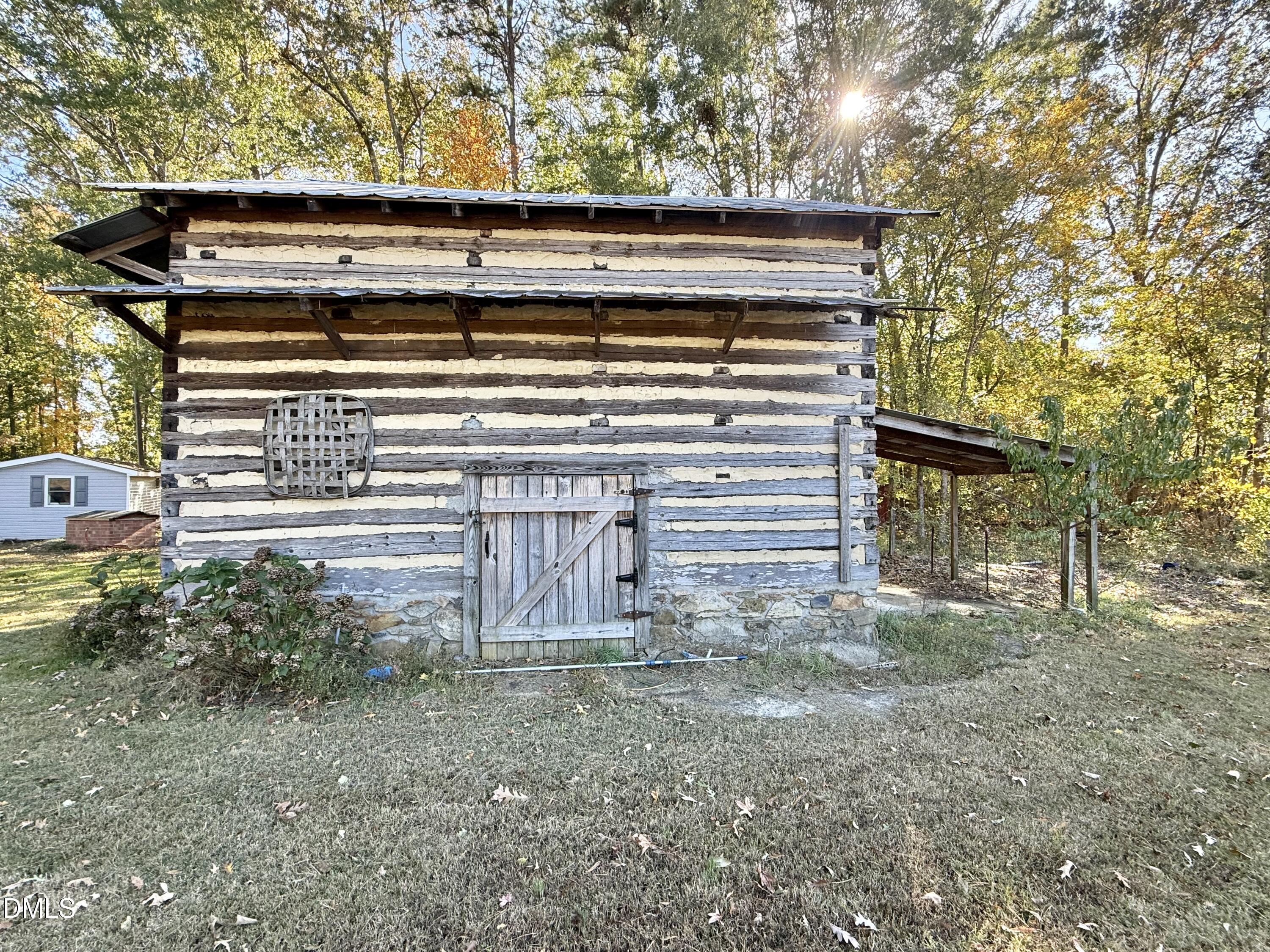 2320 Poindexter Road Hurdle Mills, NC 27541 - Photo 45 of 57 a view of house with backyard and entertaining space