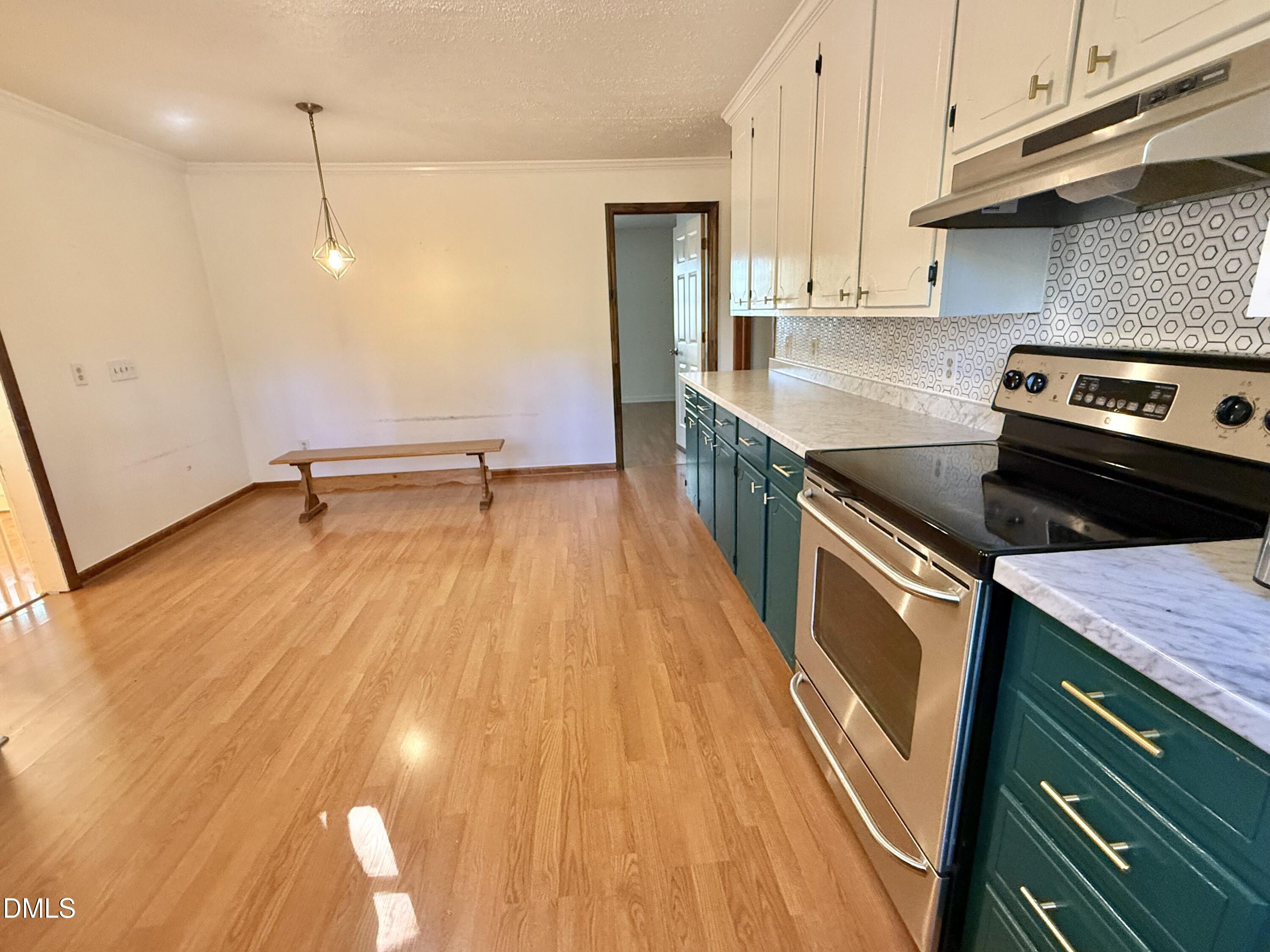 2320 Poindexter Road Hurdle Mills, NC 27541 - Photo 5 of 57 a kitchen that has a sink and a stove