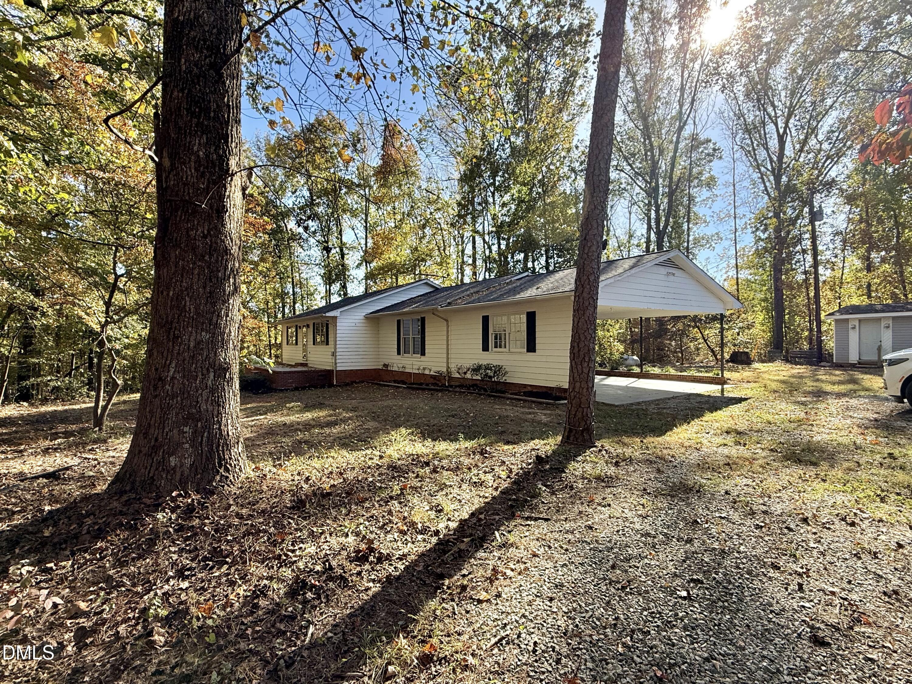 2320 Poindexter Road Hurdle Mills, NC 27541 - Photo 57 of 57 a view of a house with snow on the side of the house
