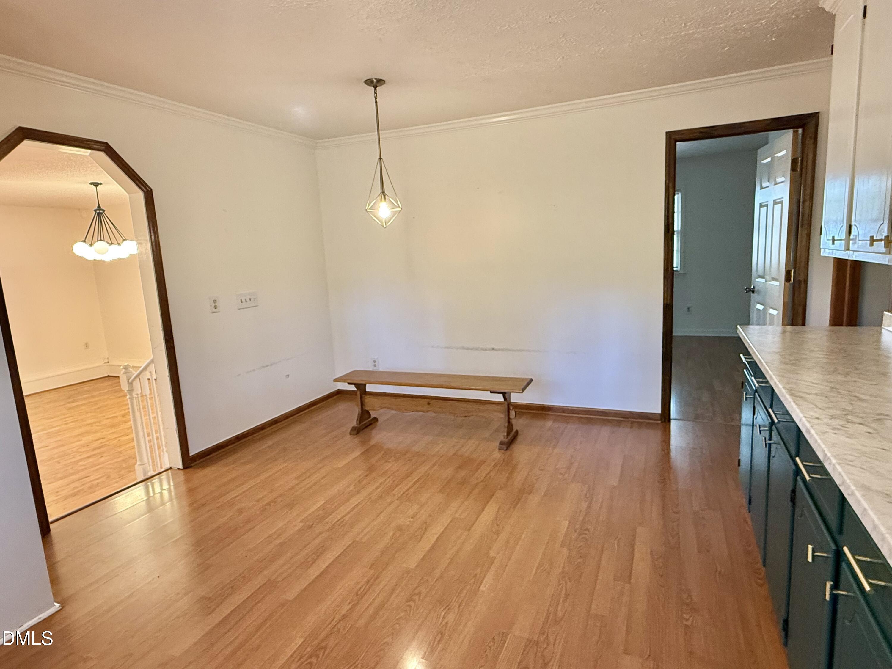 2320 Poindexter Road Hurdle Mills, NC 27541 - Photo 9 of 57 wooden floor in an empty room with a window