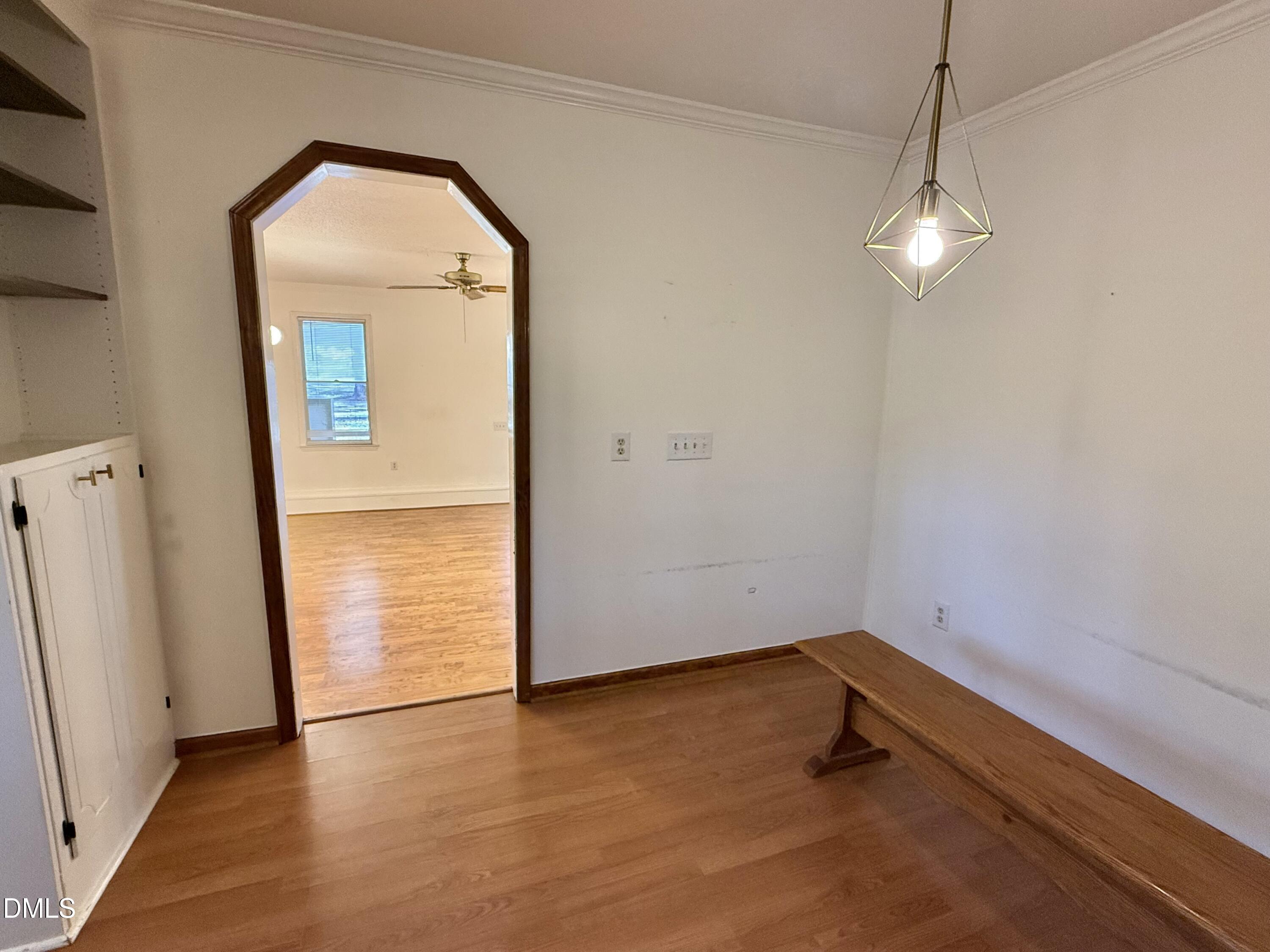 2320 Poindexter Road Hurdle Mills, NC 27541 - Photo 10 of 57 an empty room with wooden floor and windows