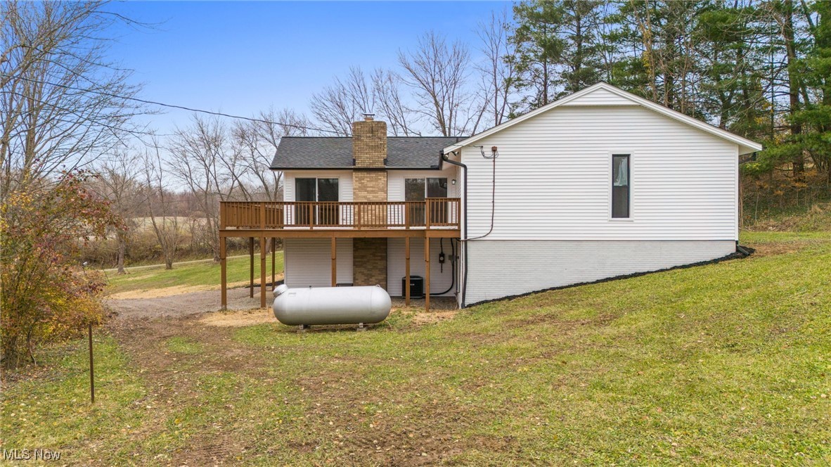 4098 State Road Medina, OH 44256 - Photo 37 of 41 Back of property featuring a deck and a lawn