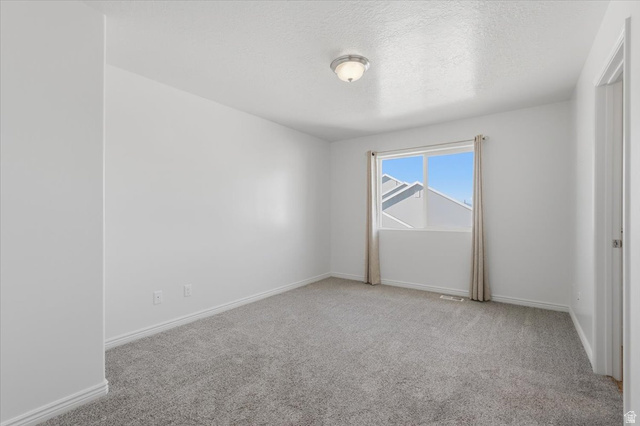 1218 Moonlight Drive Elk Ridge, UT 84651 - Photo 23 of 44 Unfurnished room with light colored carpet and a textured ceiling