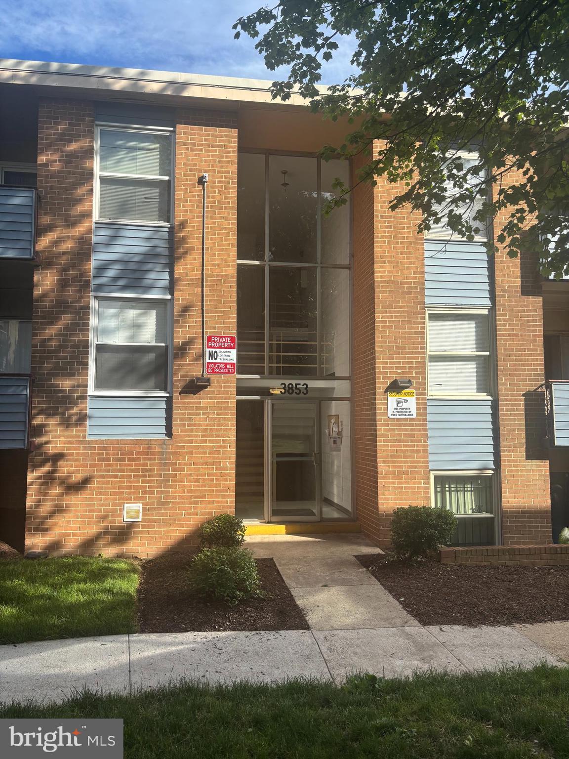 3853 St Barnabas Road, Unit 202 Suitland, MD 20746 - Photo 1 of 20 a front view of a house with a yard