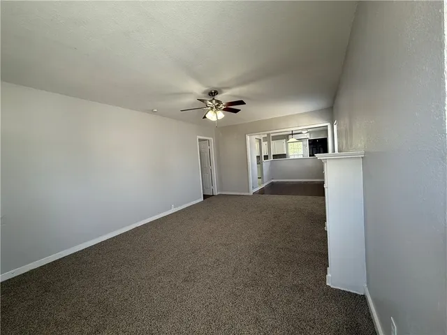 a view of a livingroom with a ceiling fan