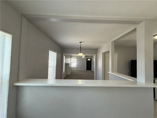 a view of a kitchen with a sink and cabinet area
