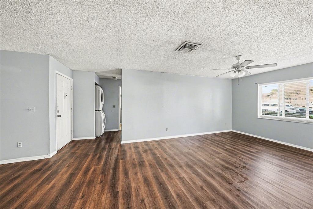 550 Golden Raintree Place, Unit 550 Brandon, FL 33510 - Photo 18 of 33 a view of a room with wooden floor and window
