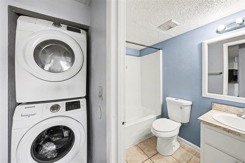 550 Golden Raintree Place, Unit 550 Brandon, FL 33510 - Photo 20 of 33 a view of a bathroom with a washer and dryer