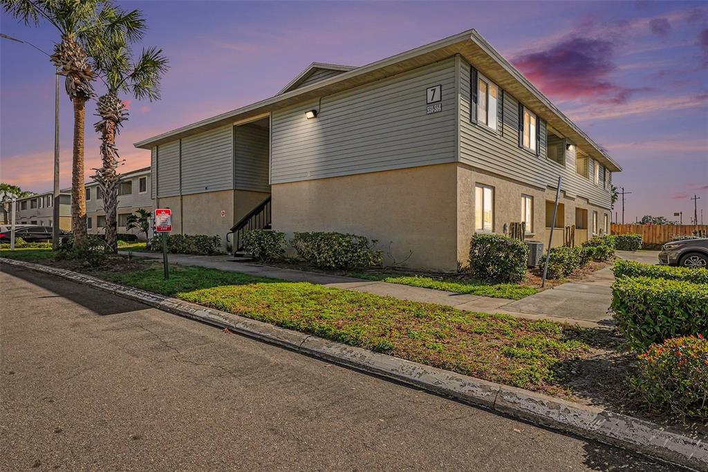 550 Golden Raintree Place, Unit 550 Brandon, FL 33510 - Photo 3 of 33 a front view of a house with garden