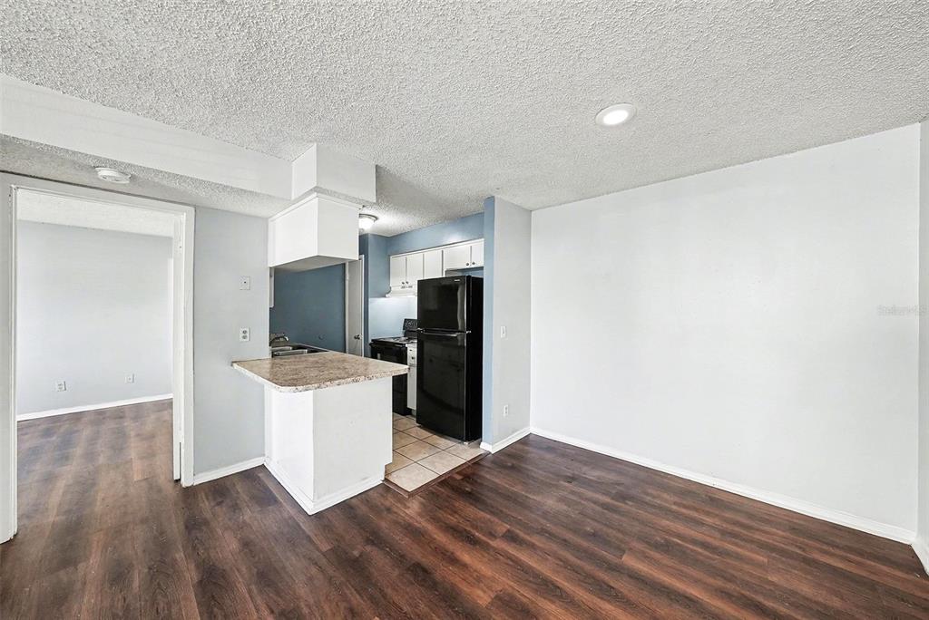 550 Golden Raintree Place, Unit 550 Brandon, FL 33510 - Photo 10 of 33 a view of a kitchen with a sink and a refrigerator