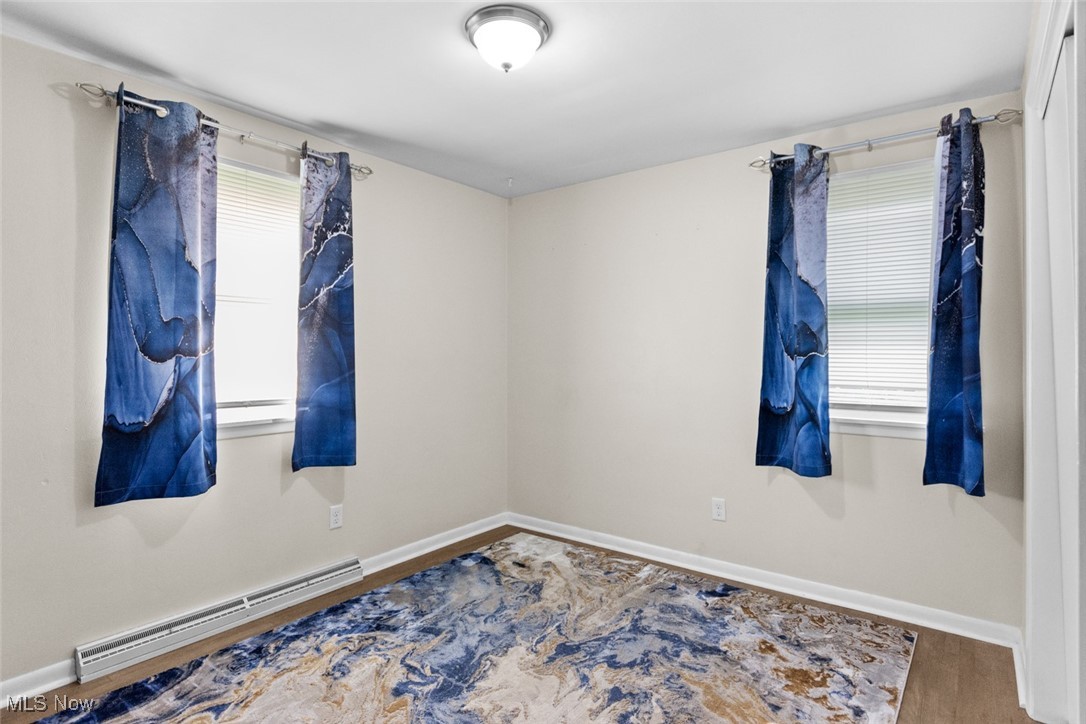 1824 Amherst Road Northeast Massillon, OH 44646 - Photo 21 of 34 bedroom featuring hardwood flooring