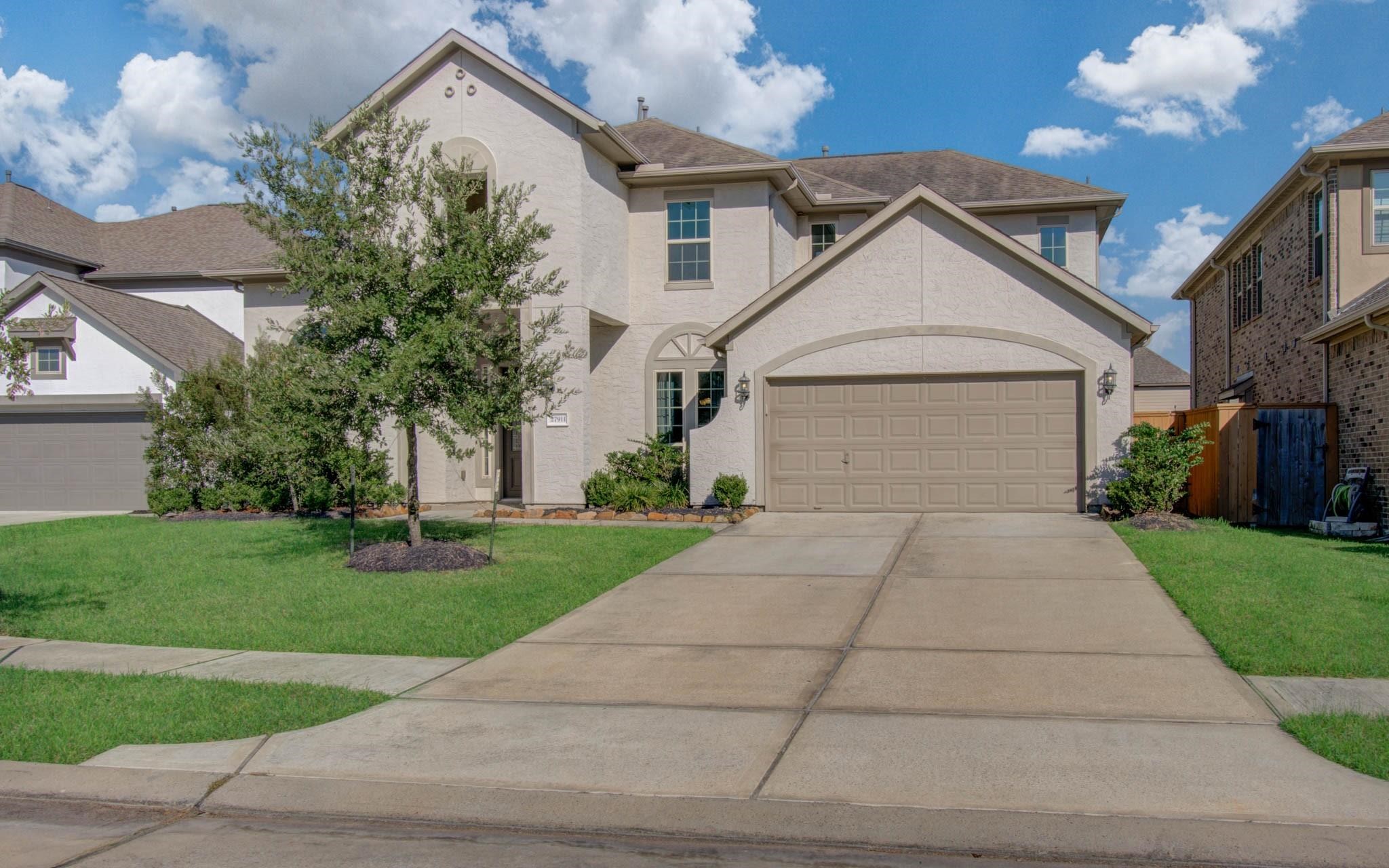 27911 Seger Bnd Trail Spring, TX 77386 - Photo 1 of 49 a view of a house with a yard