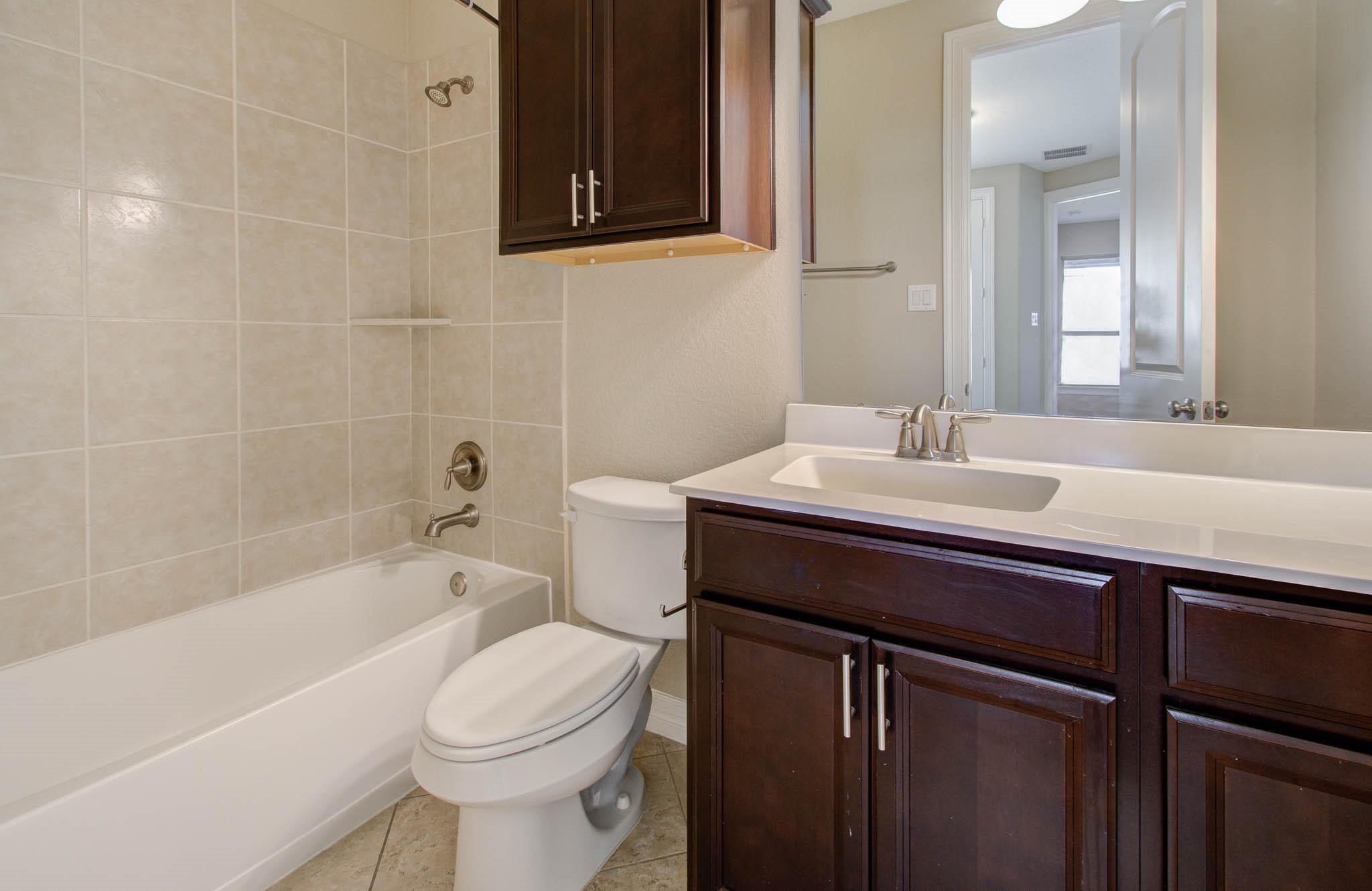 27911 Seger Bnd Trail Spring, TX 77386 - Photo 18 of 49 a bathroom with a sink a toilet and bathtub