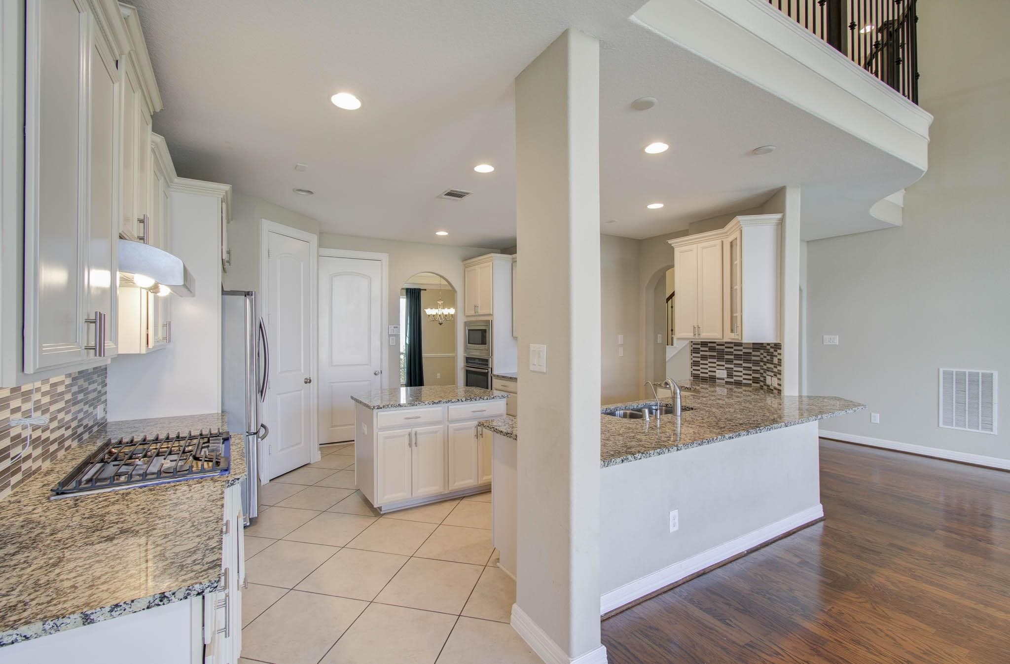 27911 Seger Bnd Trail Spring, TX 77386 - Photo 20 of 49 a large white kitchen with a large window