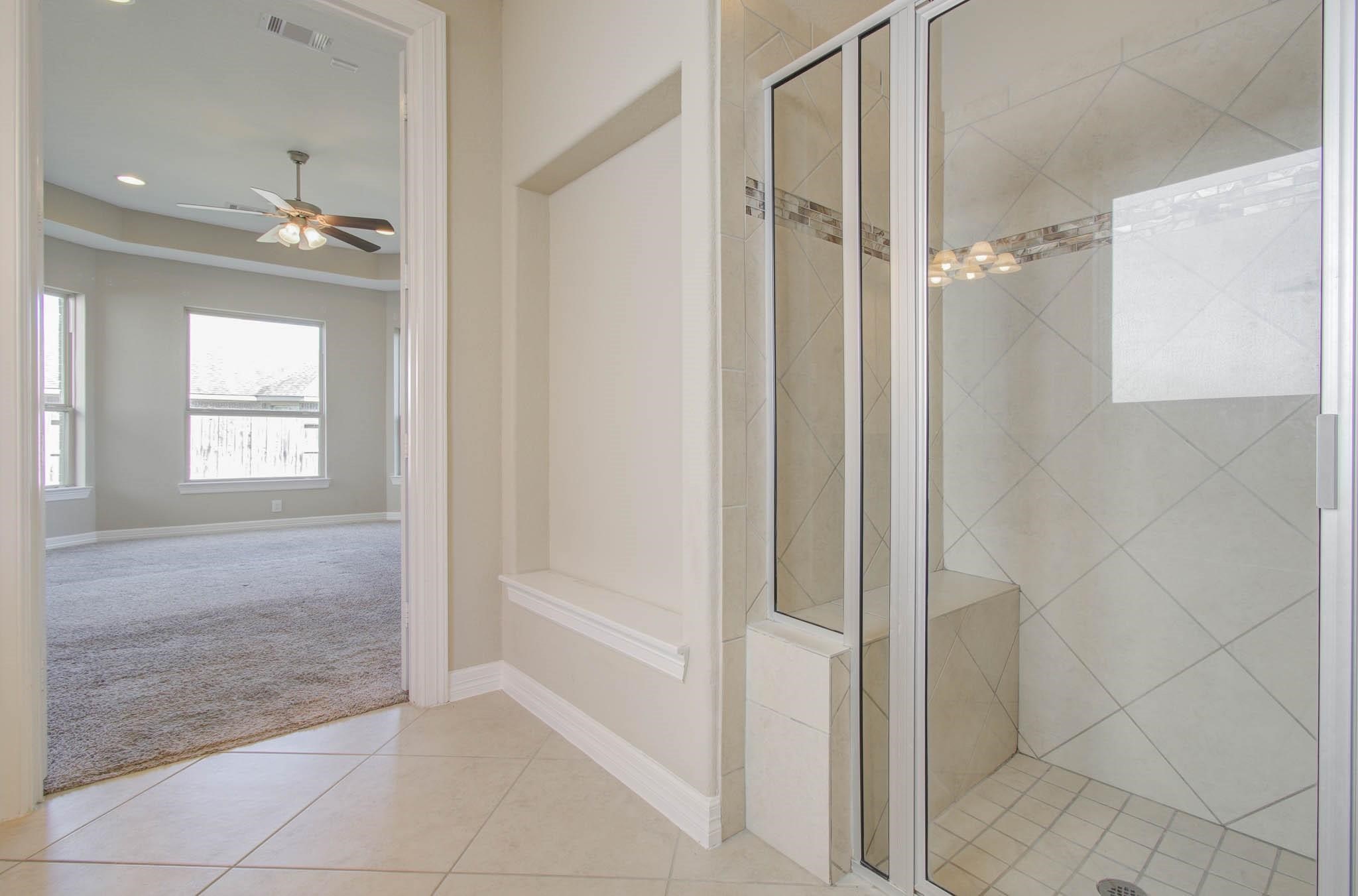 27911 Seger Bnd Trail Spring, TX 77386 - Photo 29 of 49 a bathroom with a shower and a tub