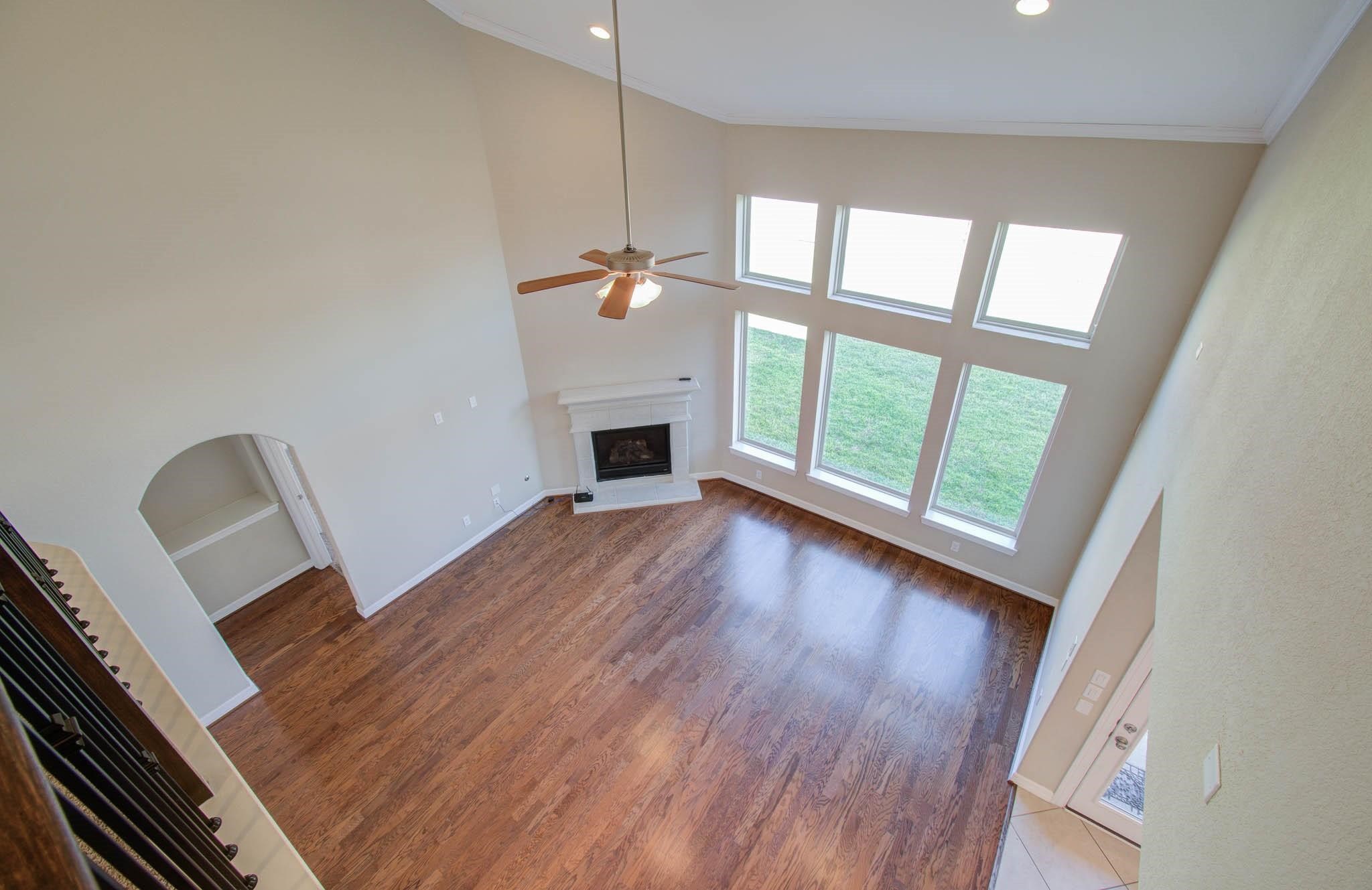 27911 Seger Bnd Trail Spring, TX 77386 - Photo 36 of 49 a view of an empty room with wooden floor and a window